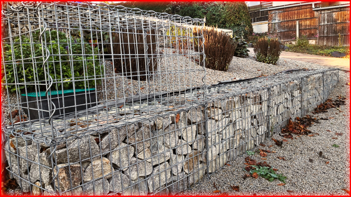 Raise and extend gabion wall on a slope with raised bed