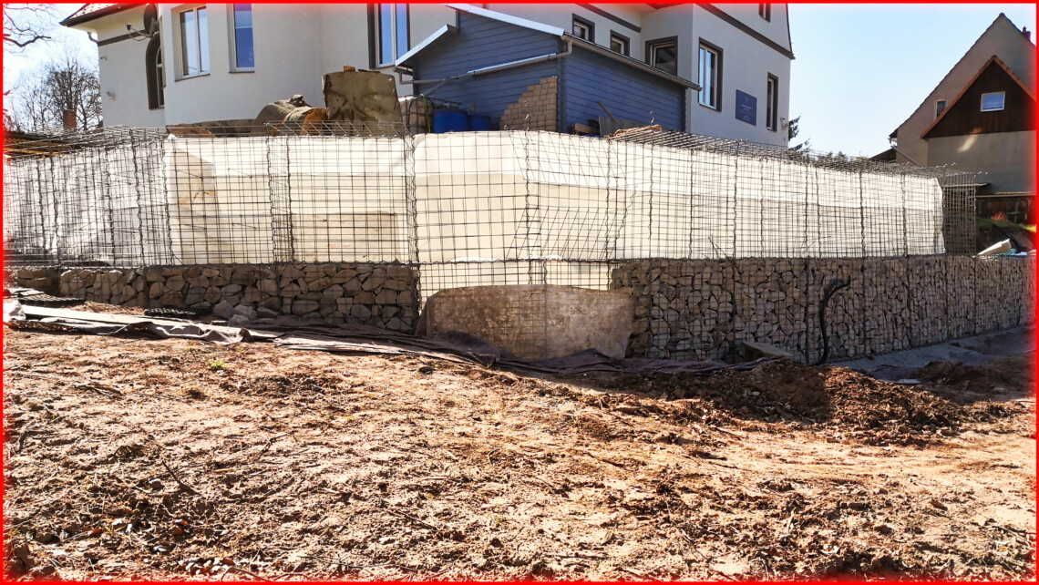 Gabion wall for slope stabilization - stacking stone baskets on top of each other