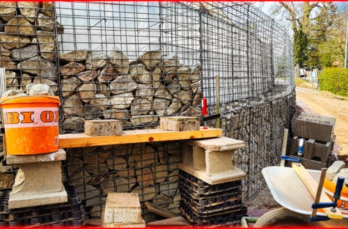 Secure slope with gabions #8 Fill second row of baskets with stones a1
