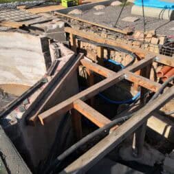 a wooden frame in a hole