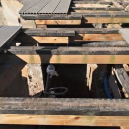 a wooden structure with metal grate