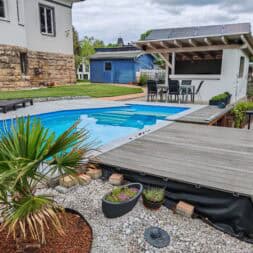 a pool with a deck and a patio