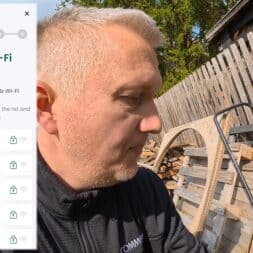 Lymow One Plus in test: RTK robot mower for large areas & difficult terrain 24 A man sets up Wi-Fi on a Lymow One Plus device outside near wooden planks and wagon wheels. A menu for selecting the Wi-Fi network is displayed on the screen, which only supports 2.4 GHz networks. www.commaik.de
