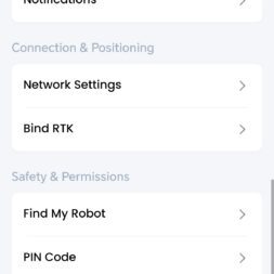 Lymow One Plus in test: RTK robot mower for large areas & difficult terrain 58 Screenshot of the Lymow One Plus settings menu with sections for Device Settings, Connection & Positioning, Security & Permissions and Device Maintenance with options such as Mowing History and Network Settings. www.commaik.de