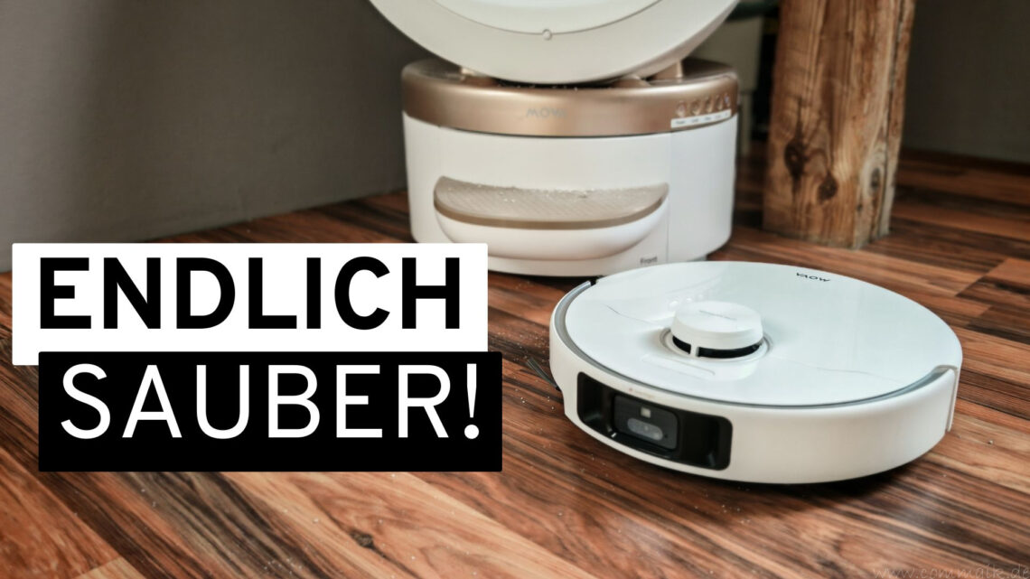 Smart Home 1 Ein weißer MOVA P70 Pro Ultra-Saugroboter steht auf einem Holzboden in der Nähe seiner Ladestation und ist bereit, Ihren Alltag zu vereinfachen. Der deutsche Text auf dem Bild lautet „ENDLICH SAUBER!“, was auf Englisch „FINALLY CLEAN!“ bedeutet – und die beeindruckenden Ergebnisse unseres jüngsten Saugroboter-Tests verdeutlicht. www.commaik.de