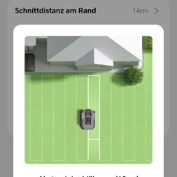 TerraMow V1000, V600, and Mini 500 Review: Robotic Lawn Mowers Without RTK and Lidar? 49 Smartphone screen showing a robotic lawn mower app in German. The app displays a top-down view of a mower on a lawn with mowed swaths, as well as options for adjusting the spacing between the swaths. The buttons are labeled “Cancel” and “Save.” www.commaik.de
